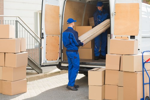 Storage team sorting recyclable cardboard and packaging in Kingston upon Thames